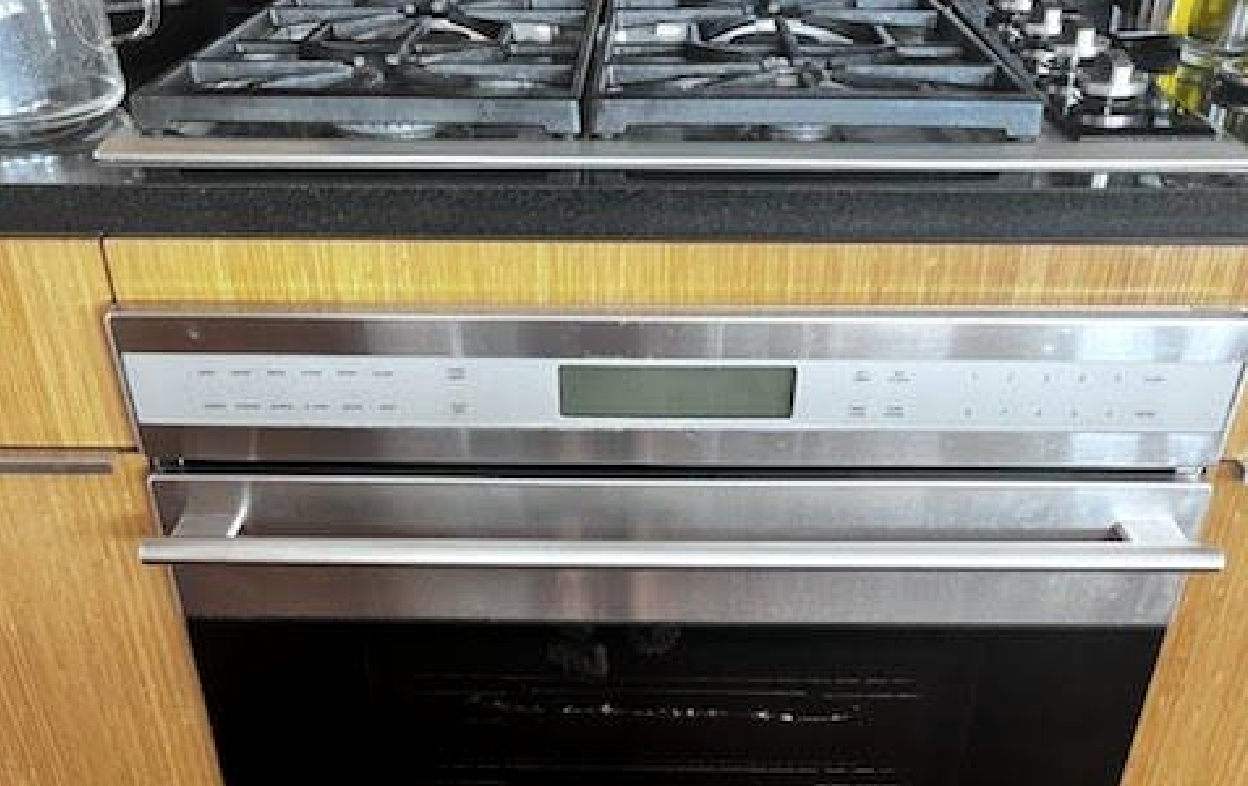 Wolf built-in oven and gas cooktop — on-site service visit in kitchen Houston, TX